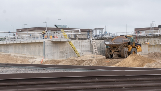 Dump track moving fill around aeration tanks at Thornbury treatment plant