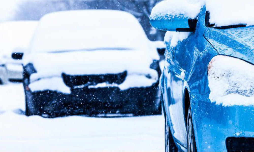 Cars parked on street in winter