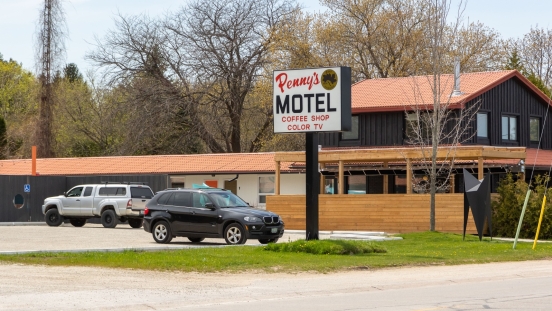 Penny's Motel sign in front of hotel