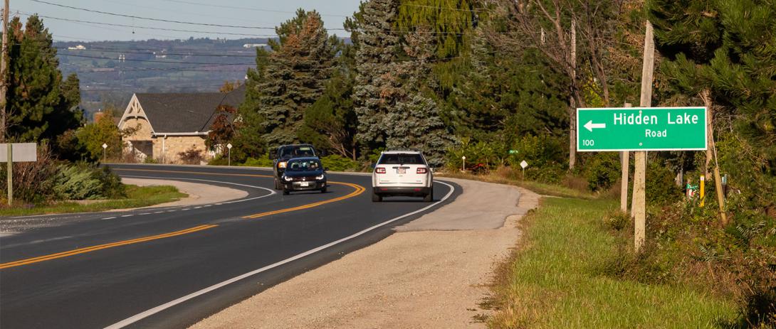 Hidden Lake Road sign on Highway 26