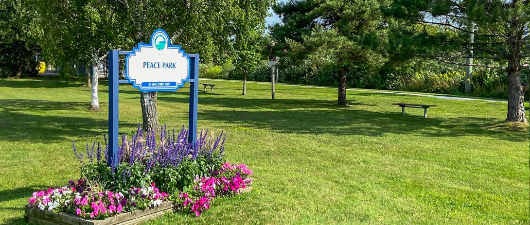 Peace Park sign in flower garden