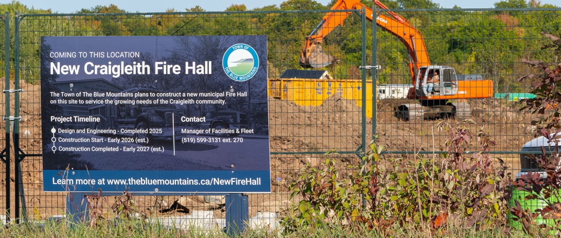 Excavators stripping topsoil at construction site