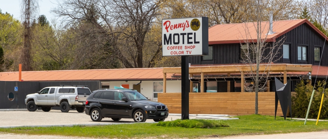 Penny's Motel sign in front of hotel