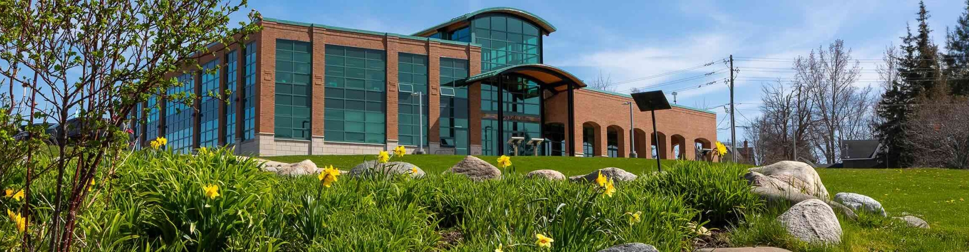 Town Hall in spring with flower garden in foreground