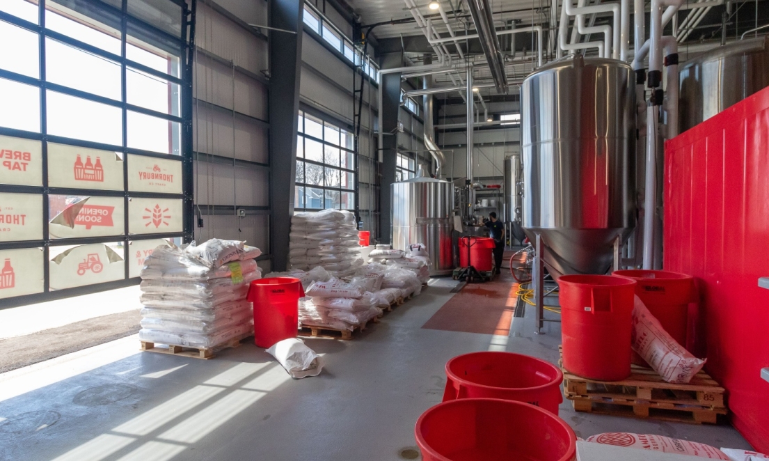 Brewery floor with tanks and supplies